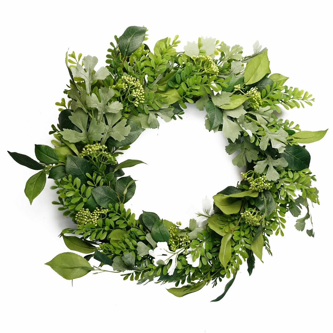 Artificial seasonal wreath with greenery hanging on a front door